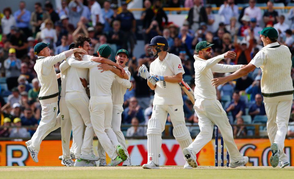  Australia celebrate after taking Chris Woakes' wicket to complete their victory