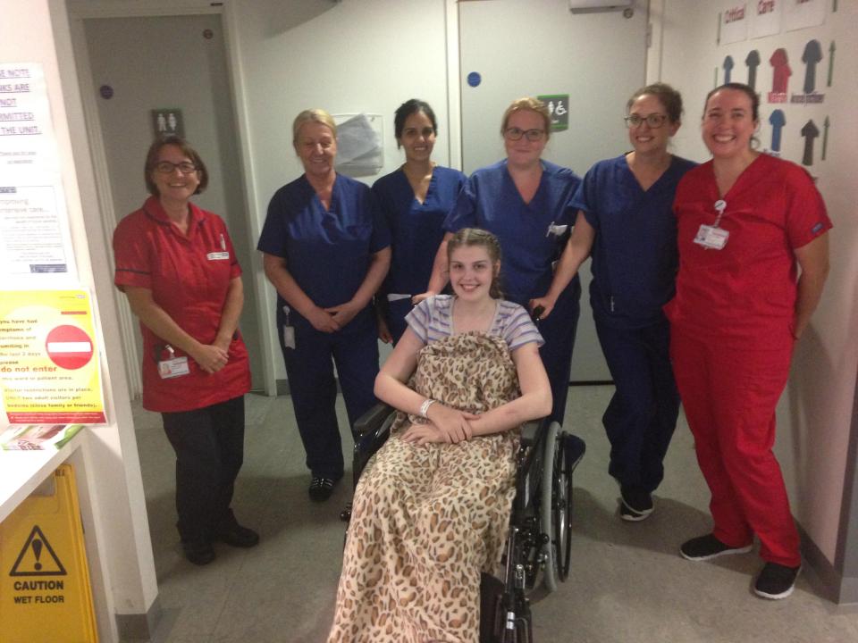  Lucy with the hospital staff that helped her recover