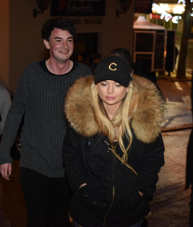  Toff wrapped up warm in a large black coat and cap