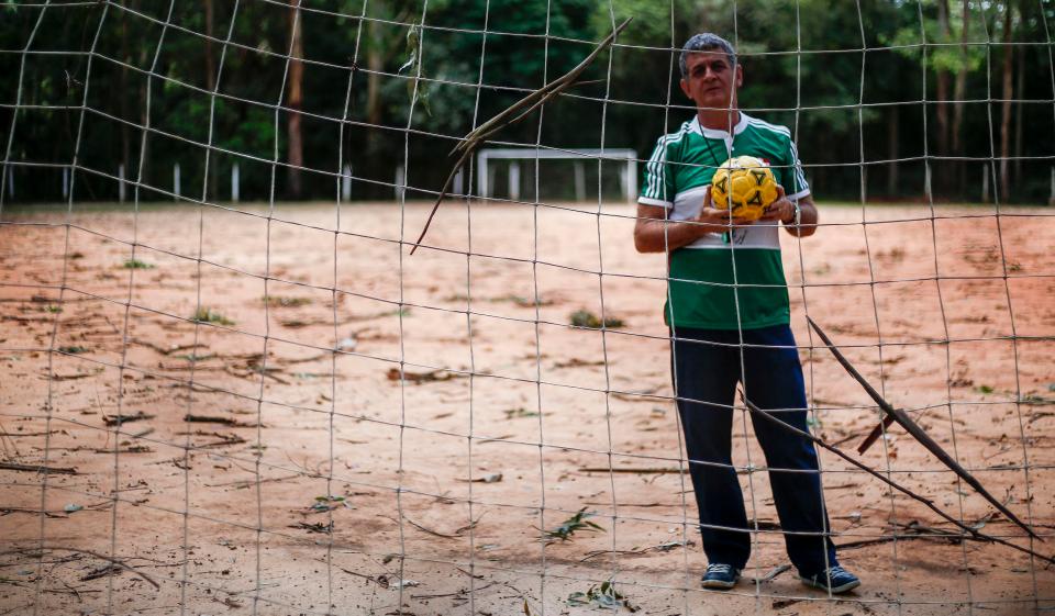  Brazilian coach Mamede poses for a photo in the Clube Pequeninos do Meio Ambiente, where the now Manchester City footballer started his career