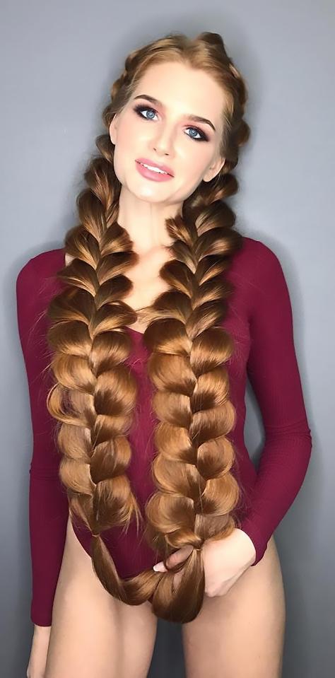  Anastasiya Sidorova's amazing red hair is 106cm (42ins) long