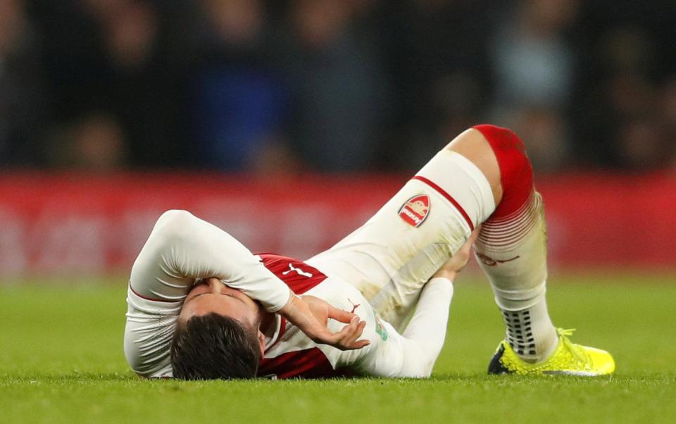  Olivier Giroud breaks down on the pitch as he suffers an injury