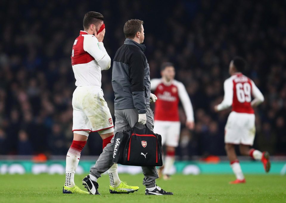  Olivier Giroud has his head in his hands as he leaves the pitch against West Ham