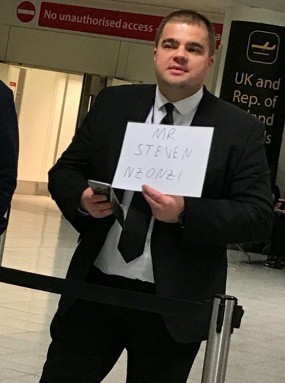 A man appeared to hold up a sign for N'Zonzi in arrivals