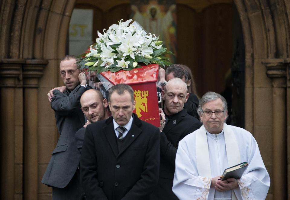  Pallbearers carry the coffin of a young footballer who tragically lost his life