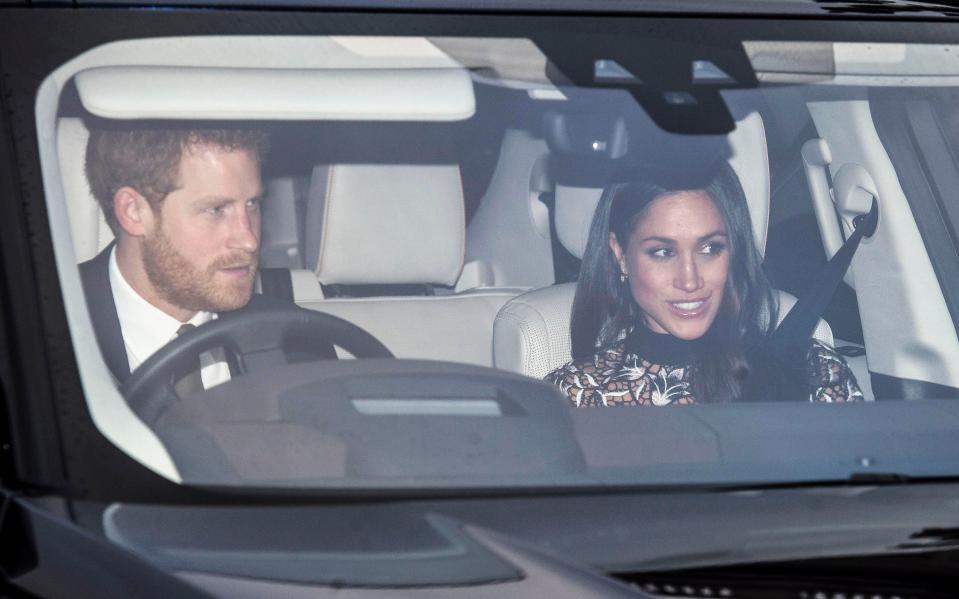  Meghan smiled beside her fiance Prince Harry as they arrived for the family Christmas lunch