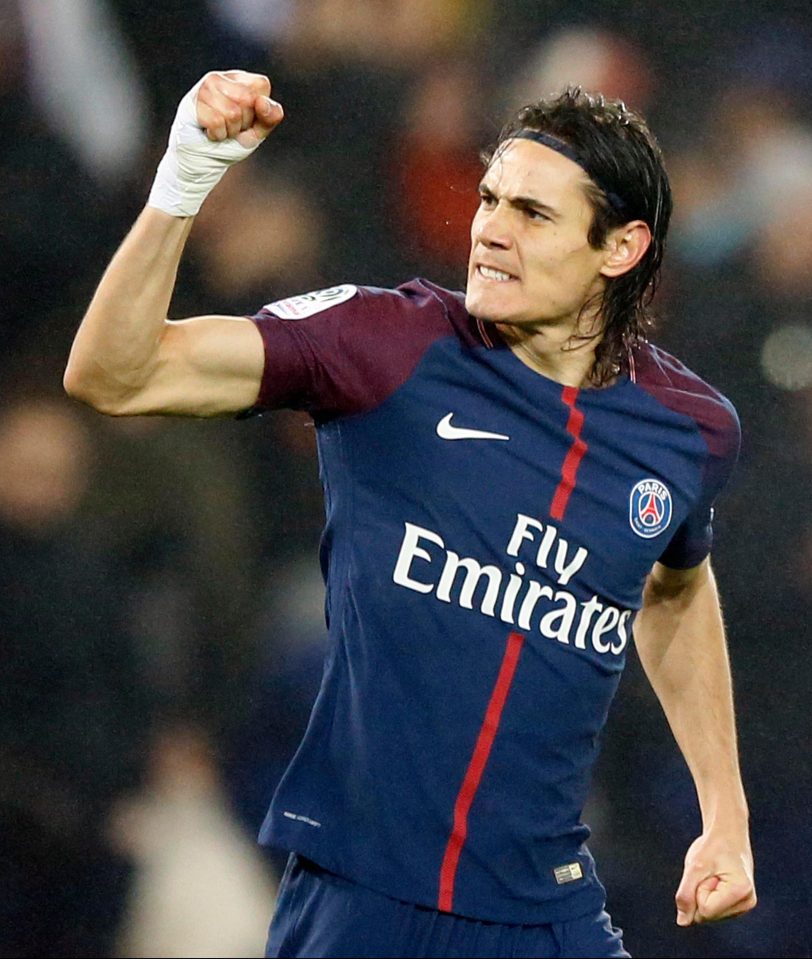 Edinson Cavani celebrates his first-half opener against Caen for the Ligue 1 leaders