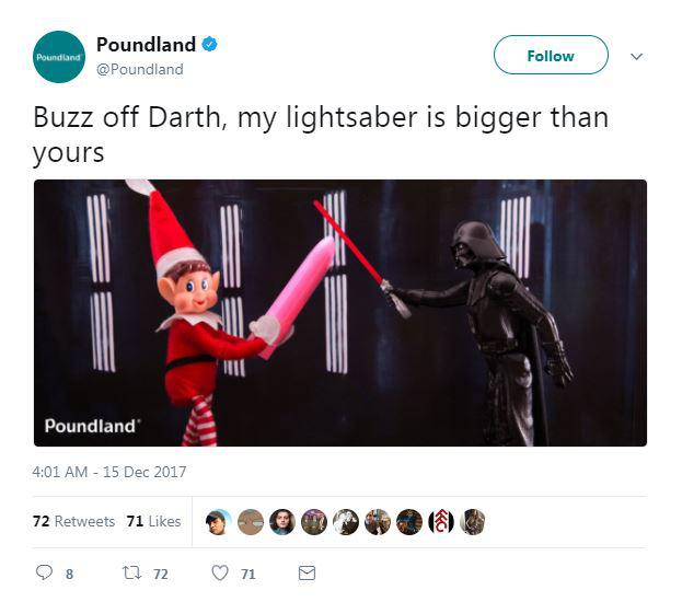 In another pic, the elf is fighting Star Wars' Darth Vader - with a sex toy