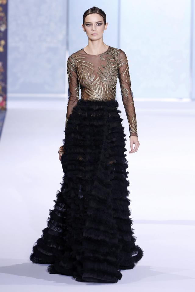  The frock’s makers  describe it as a 'black tulle gown with silk org­an­za skirt'