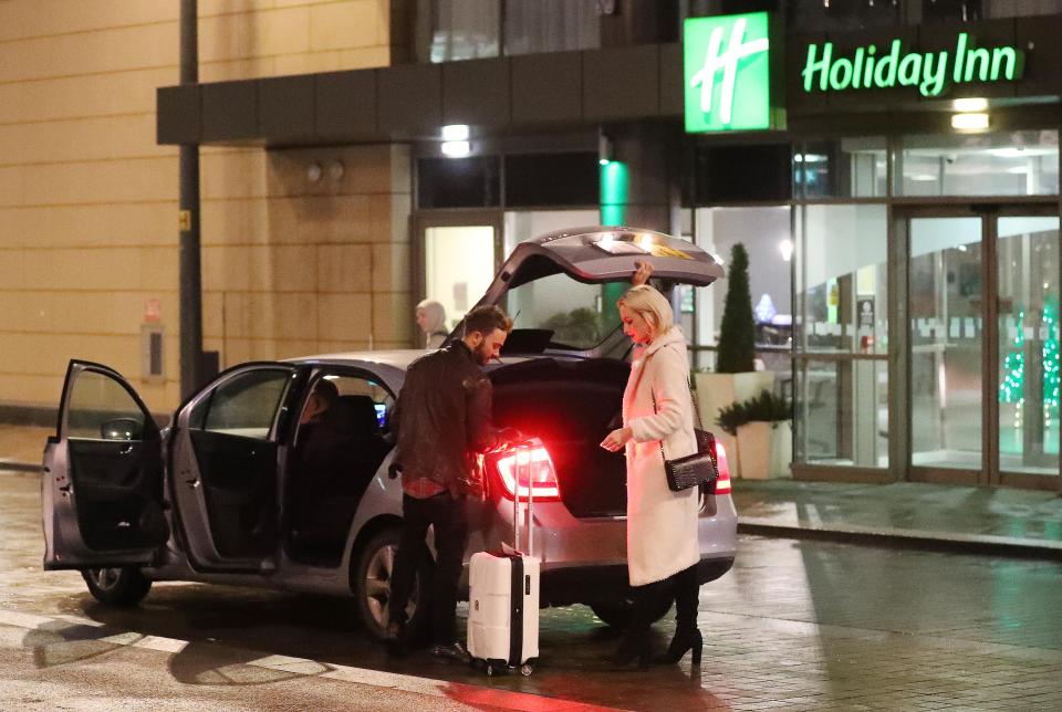  The pair were seen putting a suitcase into a car outside the Holiday Inn