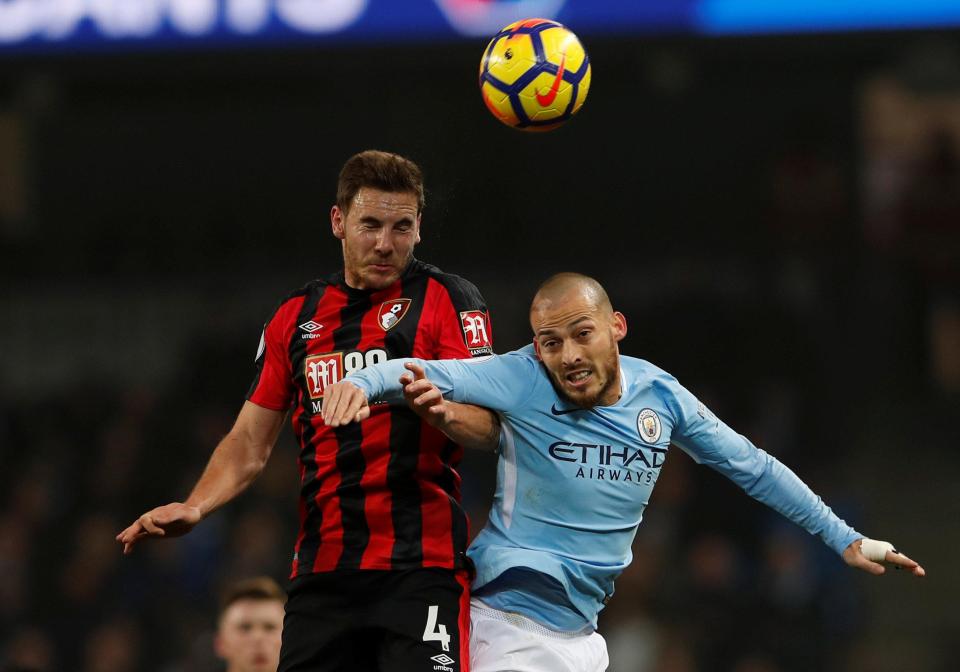  David Silva in action with Bournemouth's Dan Gosling