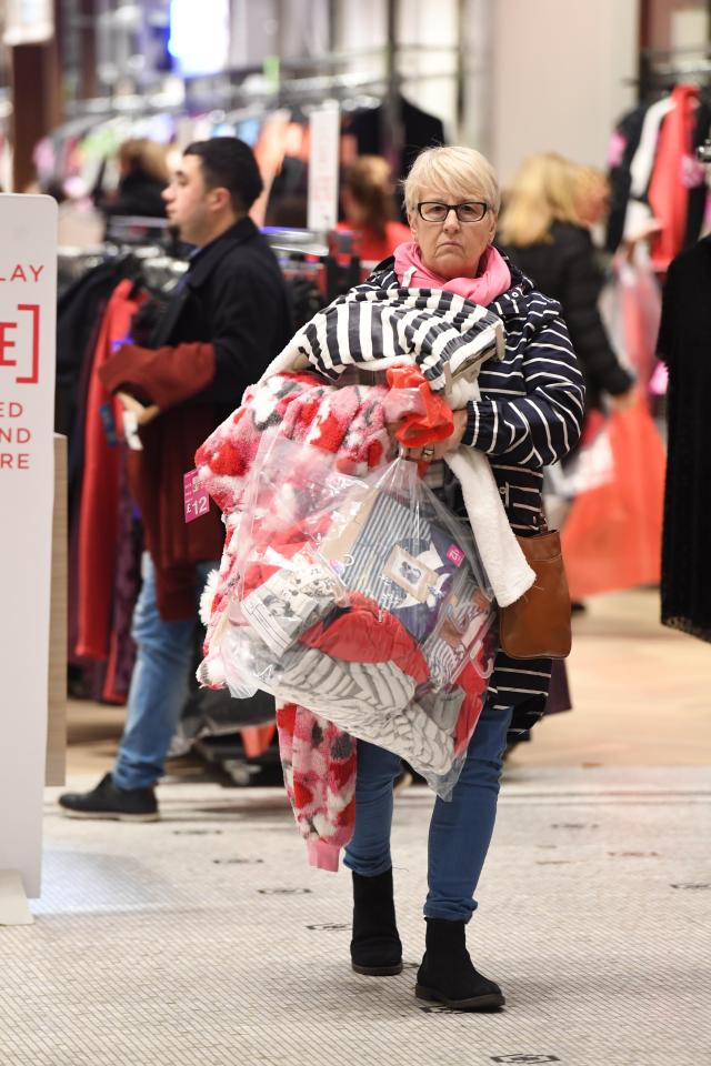  One early riser was weighed down with bags after grabbing her bargains in Cardiff this morning