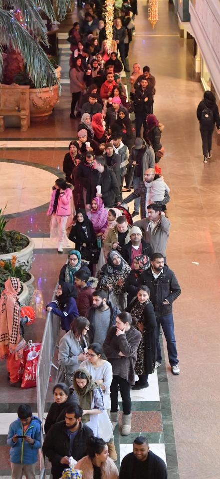  Keen to snap up some cheap Christmas deals, many queue at the Trafford Centre in Manchester ahead of shops opening this morning