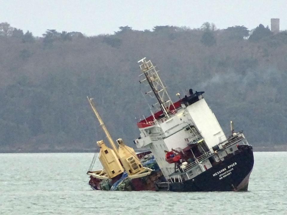 A Russian cargo ship is seen listing heavily outside Portsmouth Harbour today