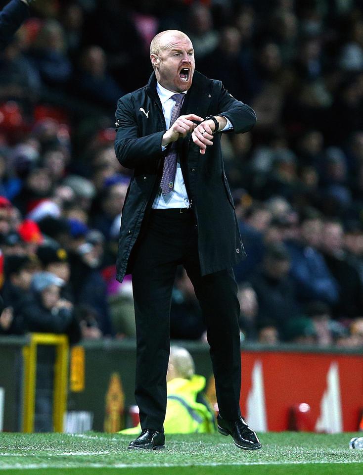  Burnley boss Sean Dyche was spotted examining the Old Trafford pitch prior to kick-off