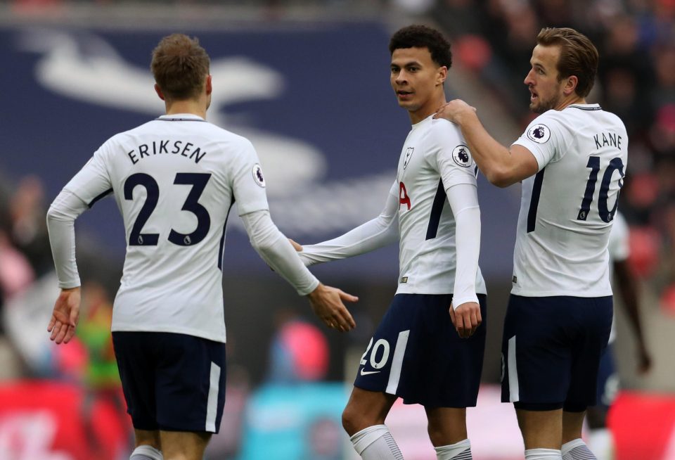  Harry Kane and Christian Eriksen celebrate with the former MK Dons ace on Tuesday