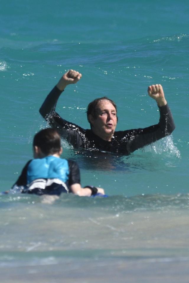  Sir Paul McCartney showed he's fighting fit at 75 as he hit the beach in St Barts with his family yesterday