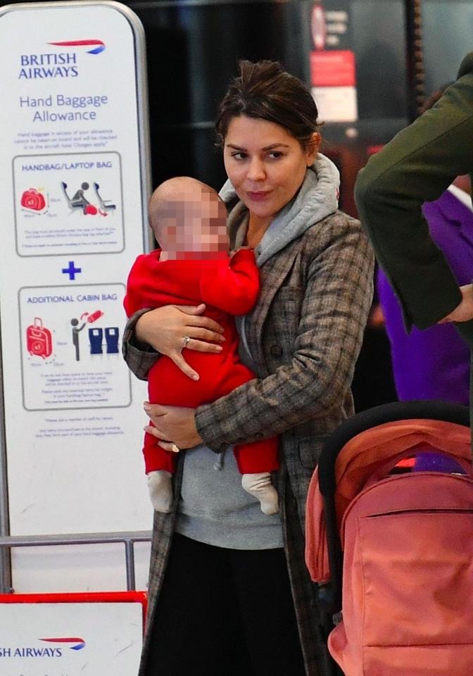  Danielle Bux was spotted with her baby daughter Romy Wren at Heathrow Airport