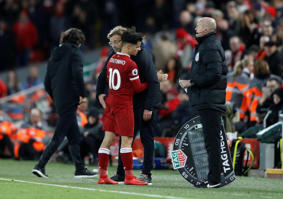  Jurgen Klopp hugs Philippe Coutinho as he leaves the field against Leicester