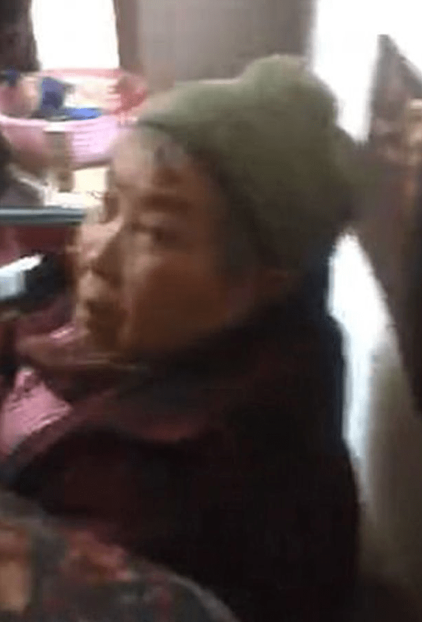  She was rescued by this elderly lady - dubbed a 'guardian angel - from the skip in Xuanwei, China