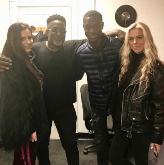  Cheryl smiled as she posed for a picture with J Hus, second from right, at a London recording studios