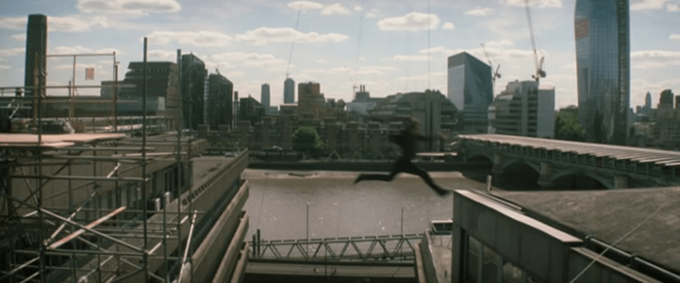 Tom Cruise can be seen leaping from one building and making his way mid-air to another