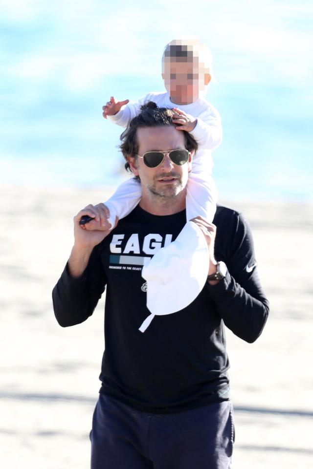  Bradley Cooper carried his baby daughter on his shoulders as he enjoyed a beach day with model girlfriend Irina Shayk