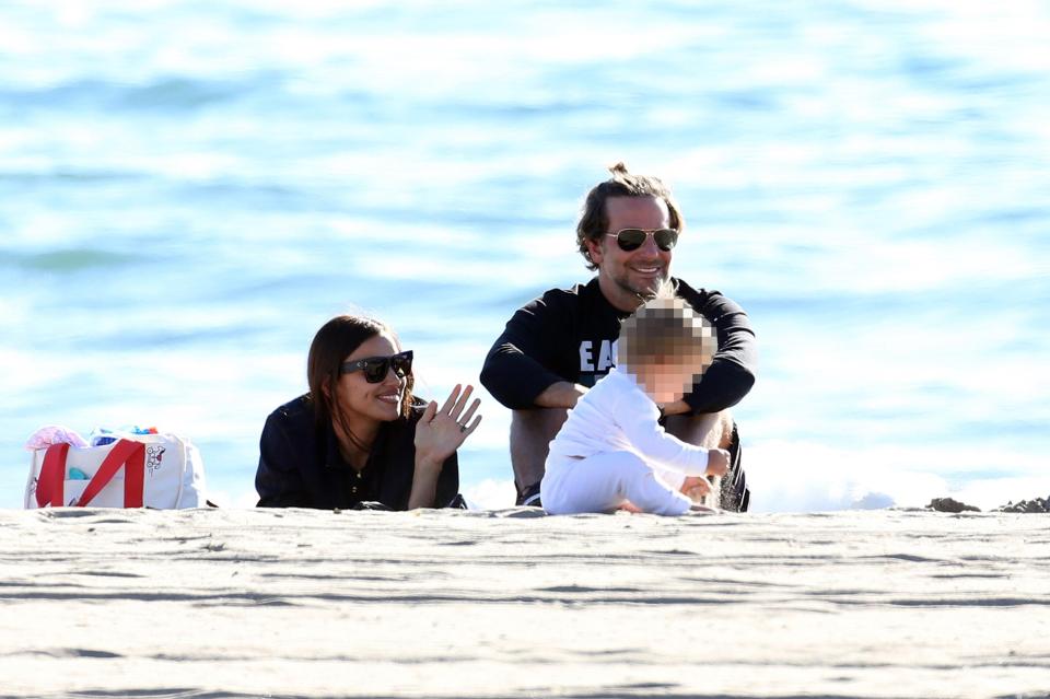  The couple were all smiles as baby Lea played on the beach