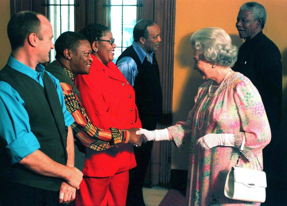  The Queen shakes hands with Hugh Masekela during Nelson Mandela's state visit to Britain in 1996