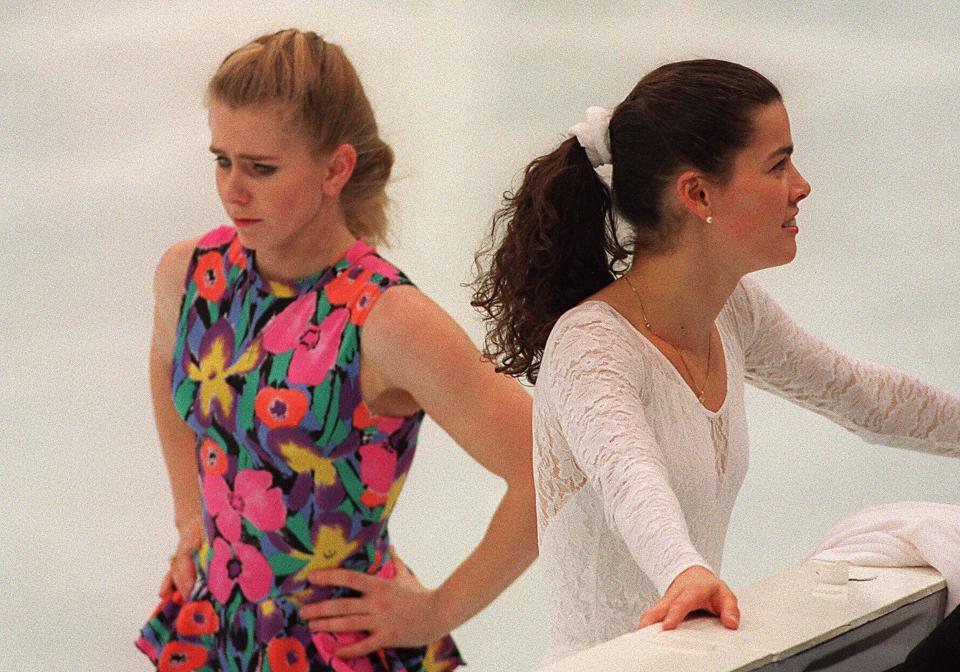  Tonya Harding, left, skates past compatriot Nancy Kerrigan during a practice session at the Olympic Games in Norway in 1994