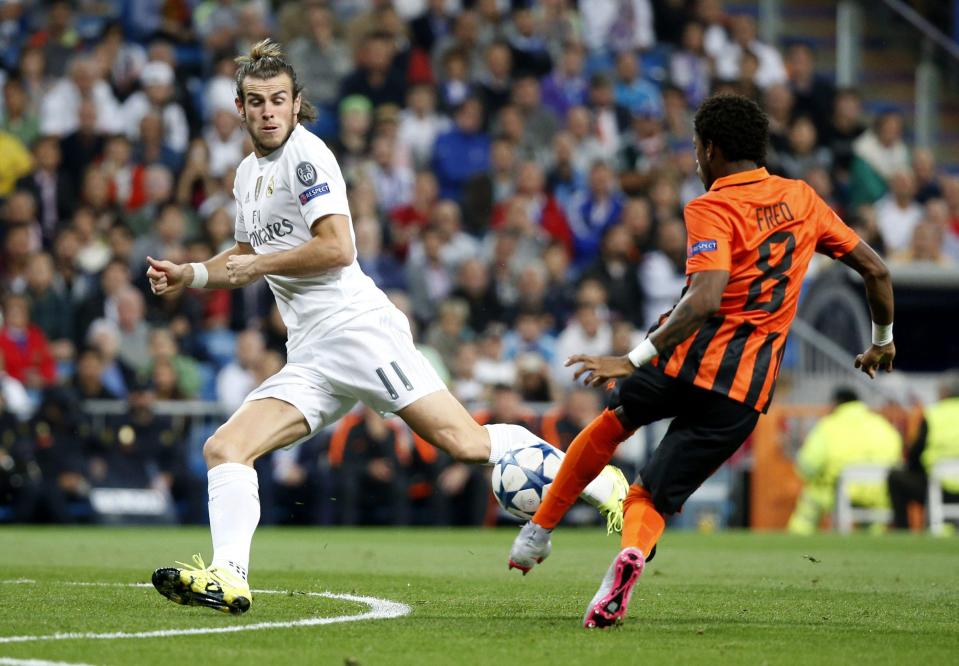  Fred in action against Real Madrid ace Gareth Bale in the Champions League