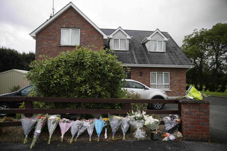 Floral tributes left outside the home of the Hawe family