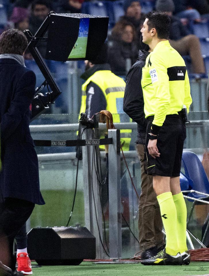  Referee Antonio Damata watches a replay using the VAR system during a Serie A match