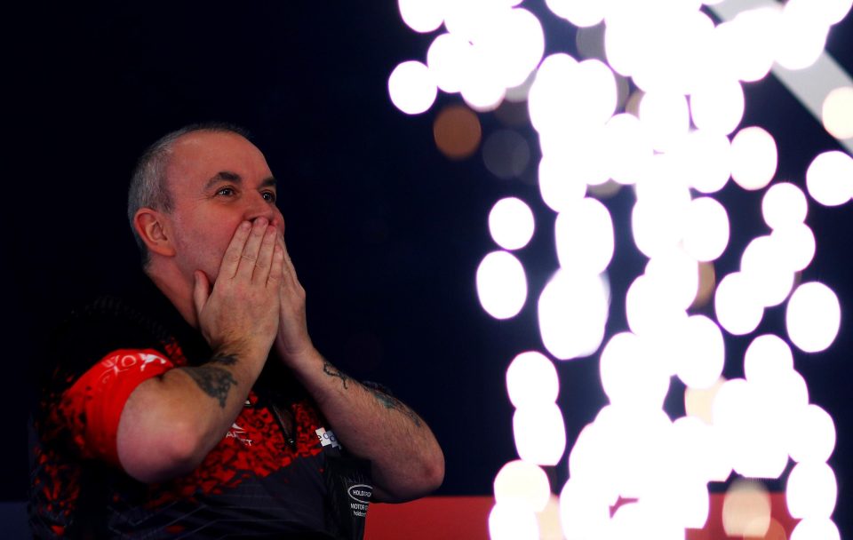  Phil Taylor could not match his rival's electric darts