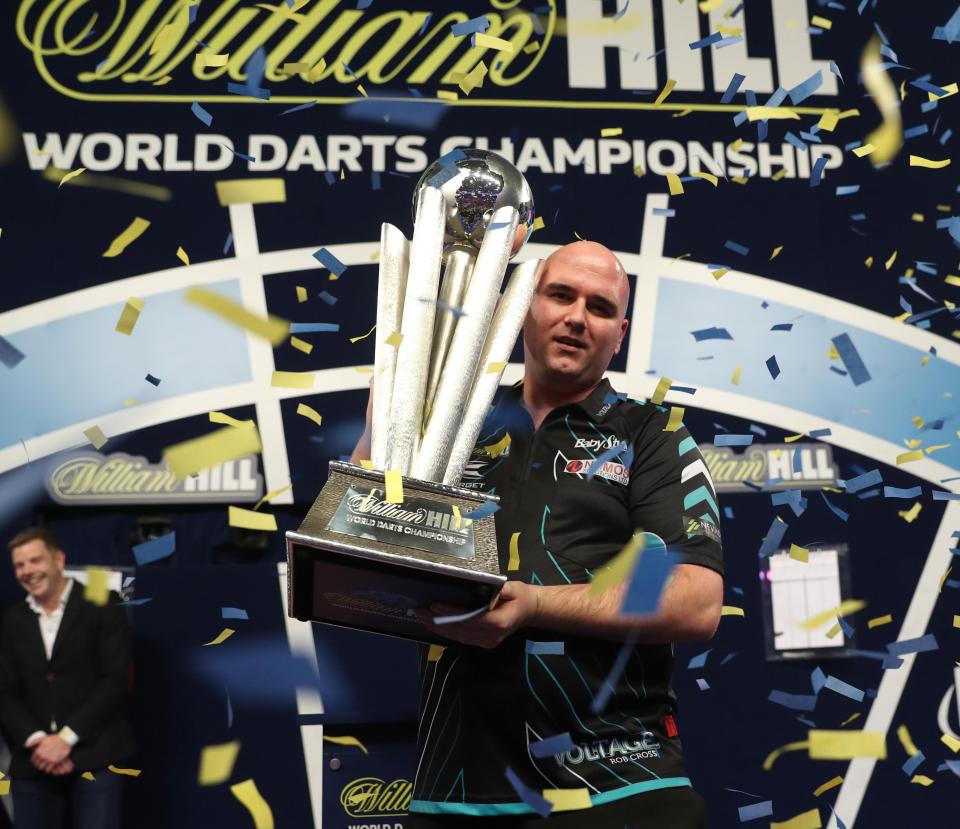  Rob Cross celebrates his stunning 7-2 win over Phil Taylor