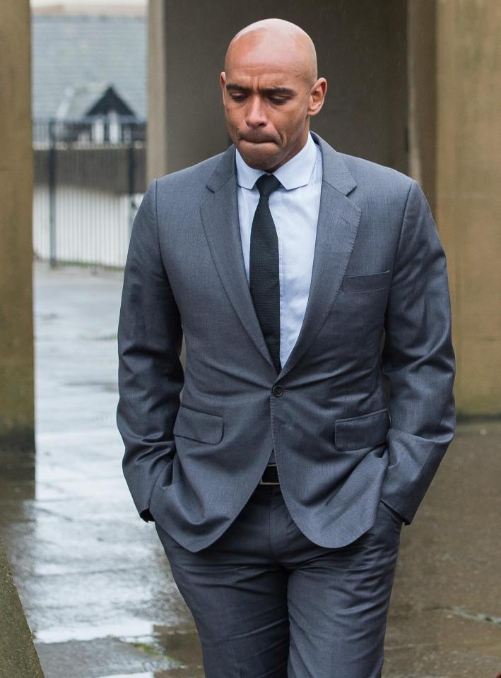  Trevor Sinclair looks downcast as he leaves court