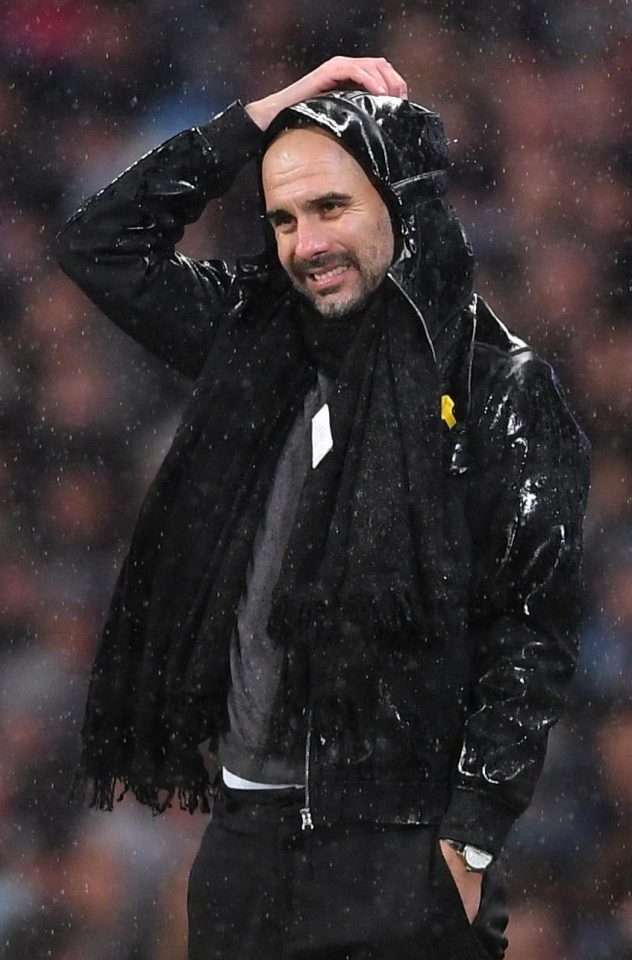  Pep Guardiola didnt seem to mind the drenched conditions