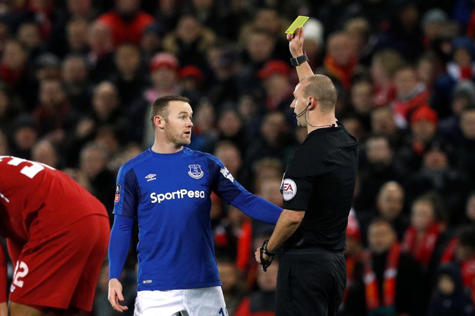 Wayne Rooney received a first half caution at Anfield as he struggled to make an impact