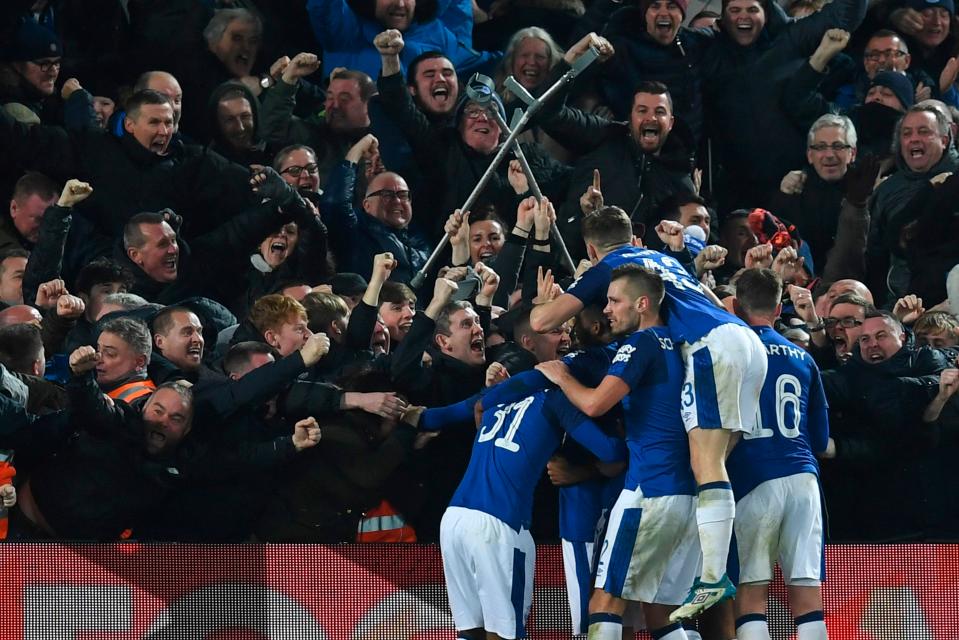 The Iceland international is mobbed by his Everton colleagues after bagging the equaliser