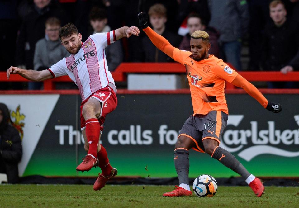  Reading star Leandro Bacuna attempts to take on Danny Newton during the clash