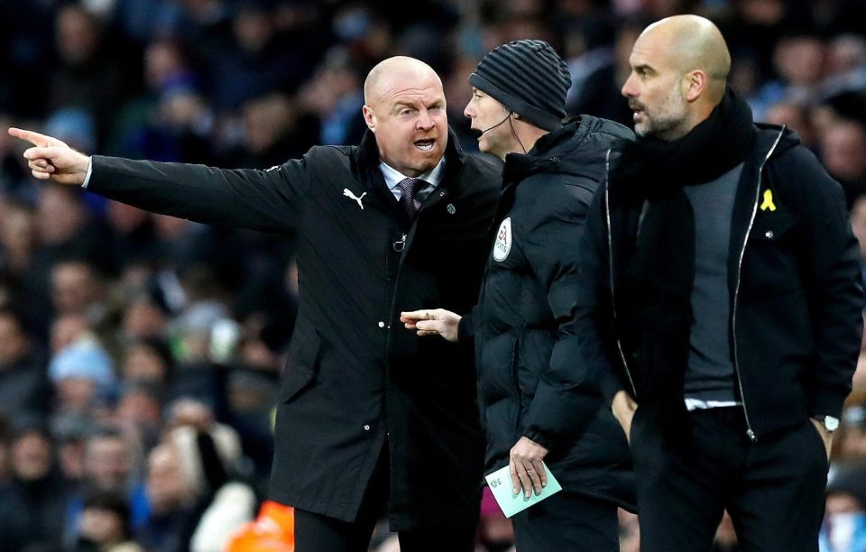  Pep Guardiola watches on as Burnley boss Sean Dyche argues the toss as his team crash out of the FA Cup