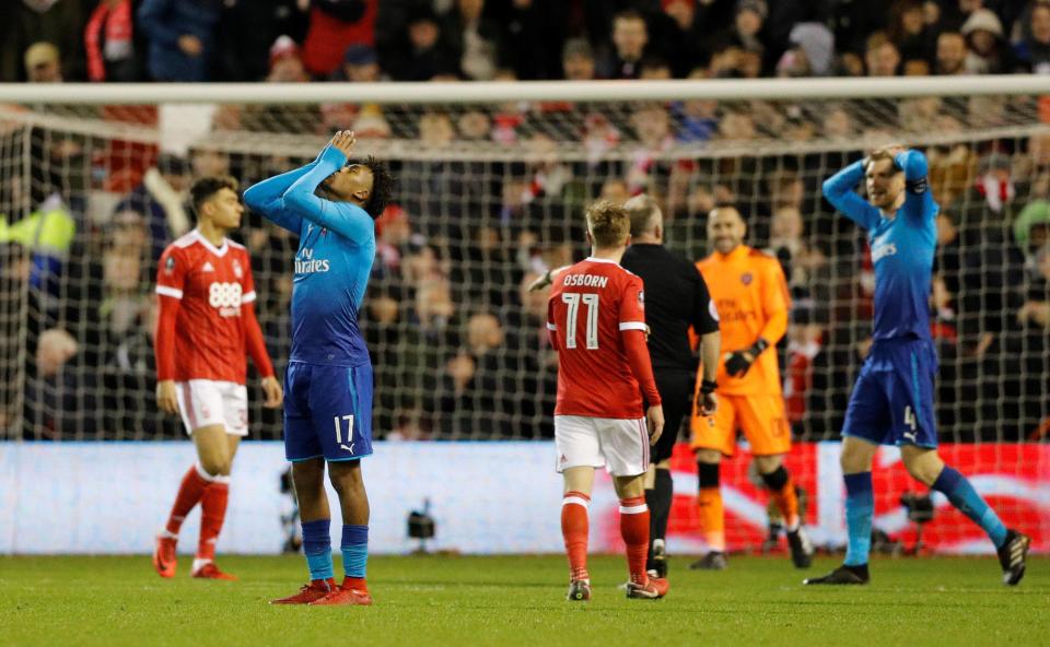  Arsenal stars Alex Iwobi and Per Mertesacker react during the FA Cup clash against Forest