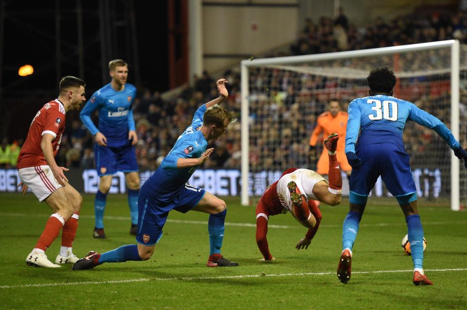  Former Bolton defender Rob Holding fouled midfielder Matty Cash inside the box