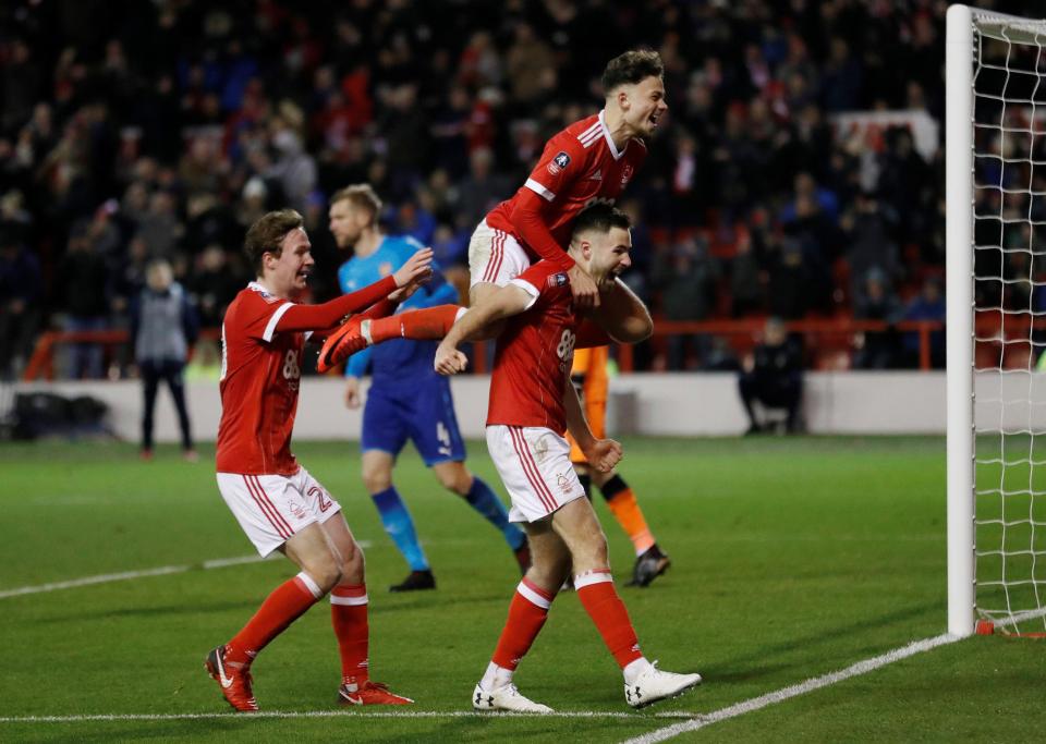  The Reds celebrate after the 18-year-old put Gary Brazil's men 3-1 up