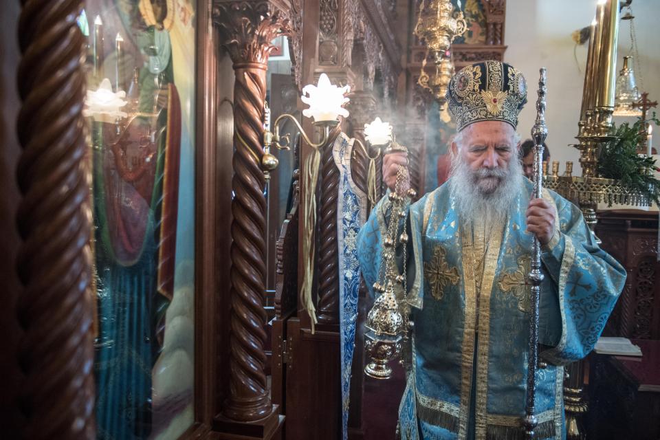  Archbishop of Thyteiri and Great Britain blesses parishioners and clergy during a traditional Greek Orthodox blessing