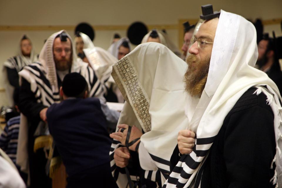  Orthodox Jewish men belonging the Bobov Hasidism during Morning Prayer inside a Stamford Hill synagogue