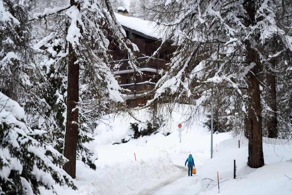  A pedestrian braves the snow in the small resort of Zinal