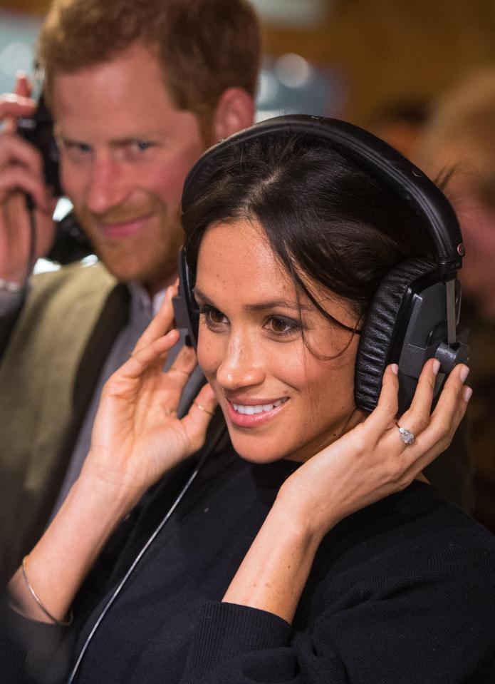 Meghan was keen to be hands on during the visit, donning a pair of headphones