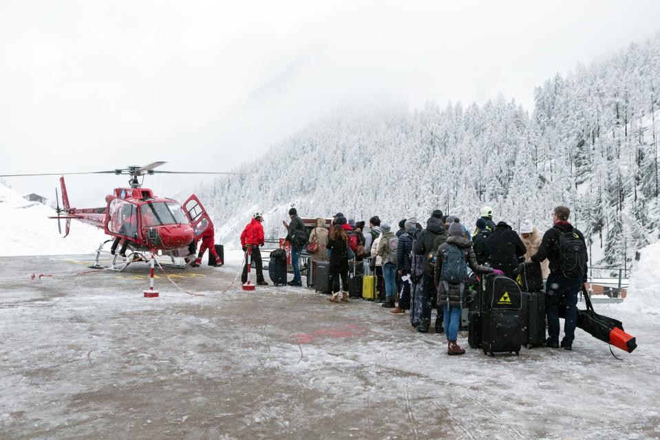  Swiss authorities deployed helicopters to ferry some tourists to a nearby village