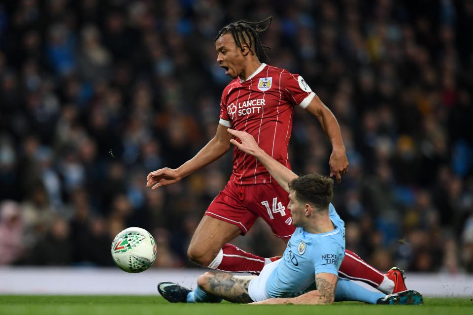  John Stones brings down Bobby Reid in the box